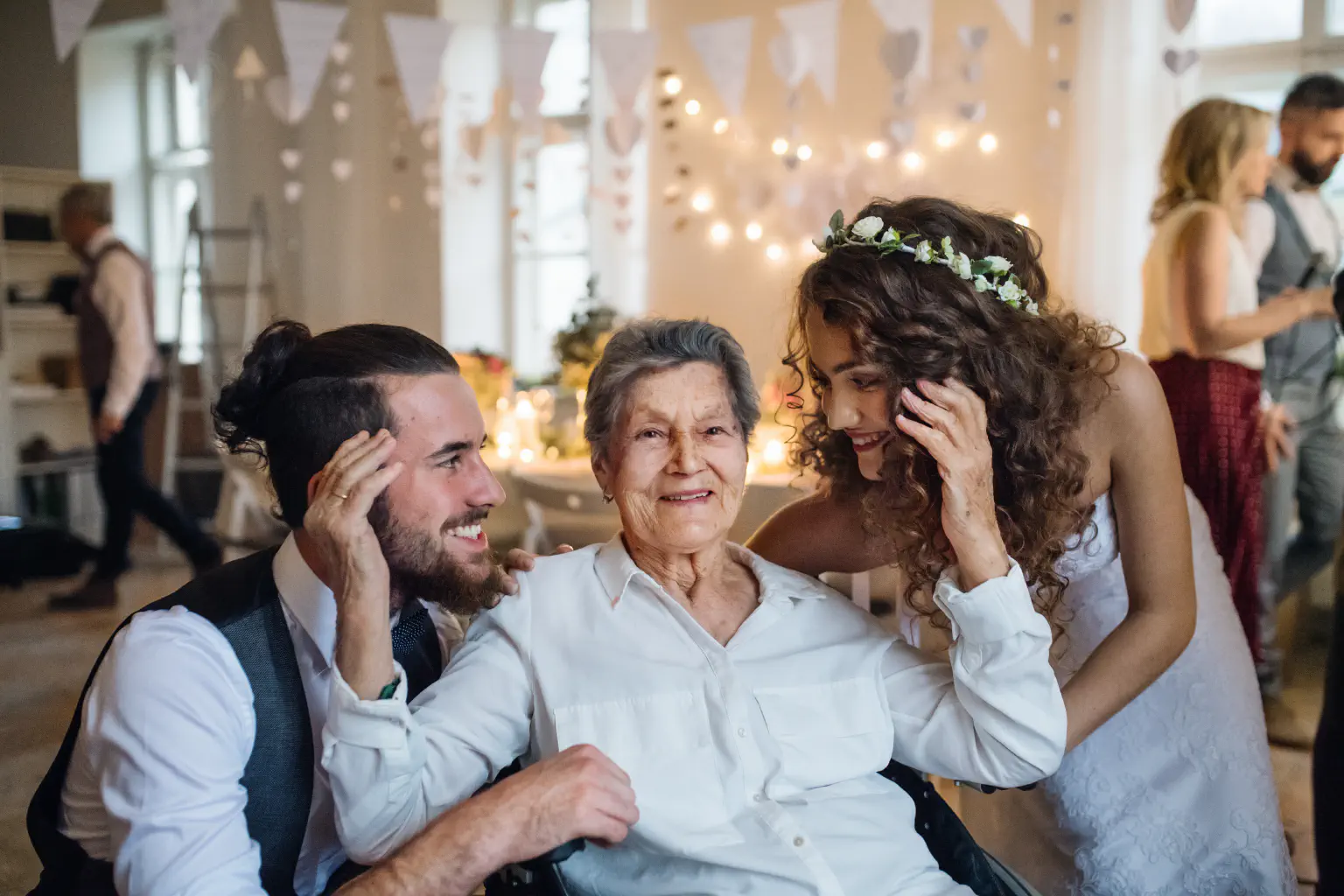 Grandmother at a wedding with the bride and groom